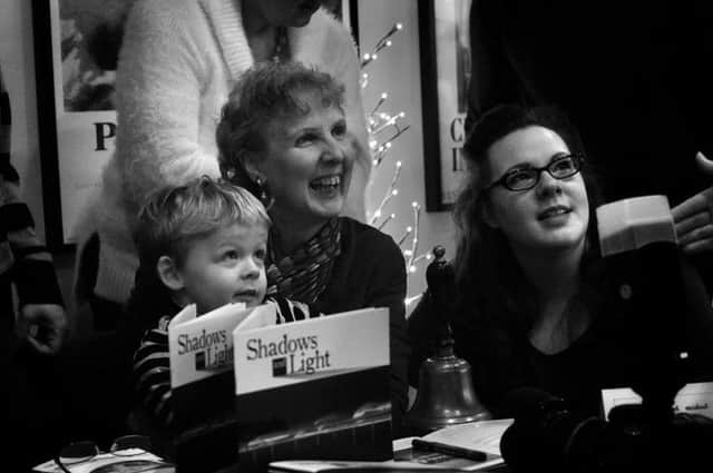 Evelyn with daughter Stephanie Neumann-Flynn and grandson Max at her book launch.