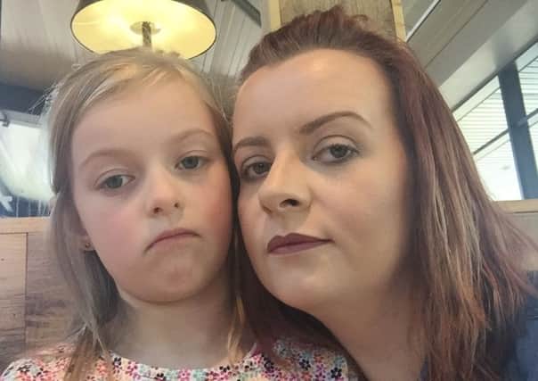 A disappointed Abbie (7) with mummy Claire Killen, after Little Mix management announced the show would not go on. Photo: Wendy Elixabeth Thompson