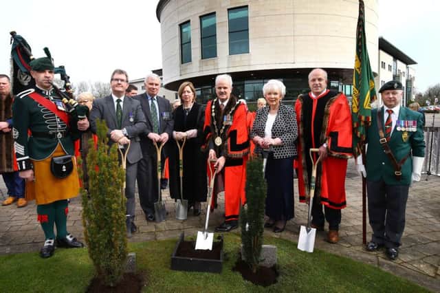 Pictured at the tree planting are Jeffrey Donaldson, MP, Lt Col. Charlie Bennett, Chief Executive, Dr Theresa Donaldson, The Mayor, Cllr Thomas Beckett, The Lord Lieutenant of County Antrim, Mrs Joan Christie and Alderman James Tinsley. Credit: William Cherry / Presseye
