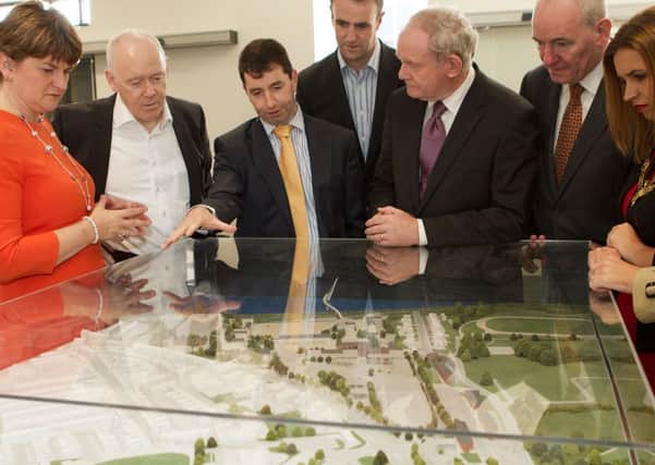 2015: Mel Higgins, Chief Executive, Ilex, discussing the layout of the Ebrington Complex on a full scale model with Deputy First Minister Martin McGuinness and Acting First Minister and Finance Minister, Arlene Foster, who visited the site for the official opening of the Creative Hub at Eighty 81 Ebrington, with on left Philip Flynn, chairman Ilex and, from right, Mayor Elisha McCallion, Mark Durkan M.P. and Mark H. Durkan, Environment Minister. (Photo - Tom Heaney, nwpresspics)