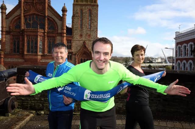 Announcing the re-opening of entries for the SSE Airtricity Walled City Marathon Race Director Noel McMonagle is joined by MLA & runner Mark H Durkan and Vicky Boden from SSE Airtricity.