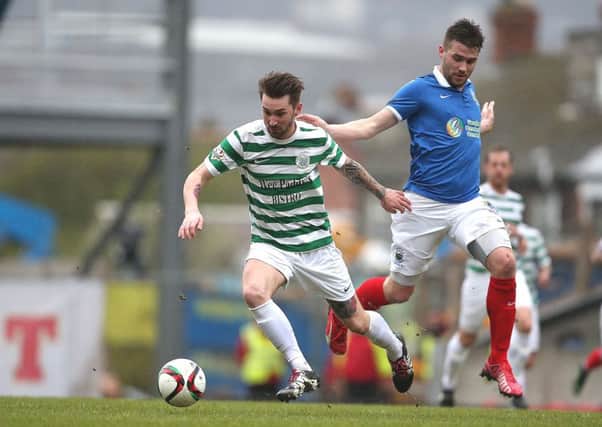 Josh Barton on the ball for Lurgan Celtic against Linfield.