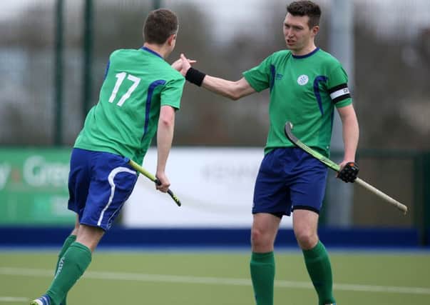 Ballymena's Lorimer (17) is congratulated by team captain Fulton after scoring in Saturday's league game with South Antrim at Ballymena Academy. INBT 14-181CS