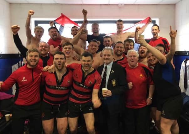 CHAMPIONS: A very proud club President, Bill Crymble, with the Carrick 1st XV after they clinched the Qualifying League Section 2 title at Coleraine on Saturday. Coming at the end of the club's 150th anniversary season, it was a day of double celebration for President and club, with the 3rd XV also winning their title. INLT 14-906-CON