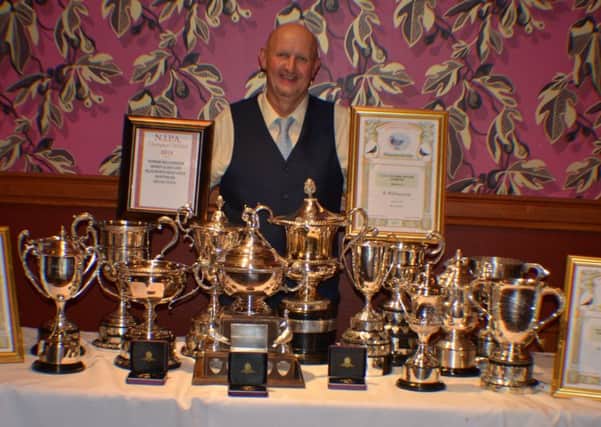 Ron Williamson with some of the prizes won.