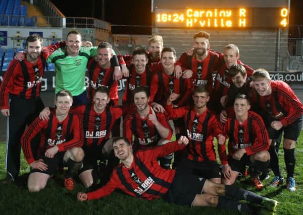 Harryville Homers celebrate their Irish Junior Cup semi-final win over Carniny Rangers in front of the electronic scoreboard at the Showgrounds. Picture: John McIlwaine.