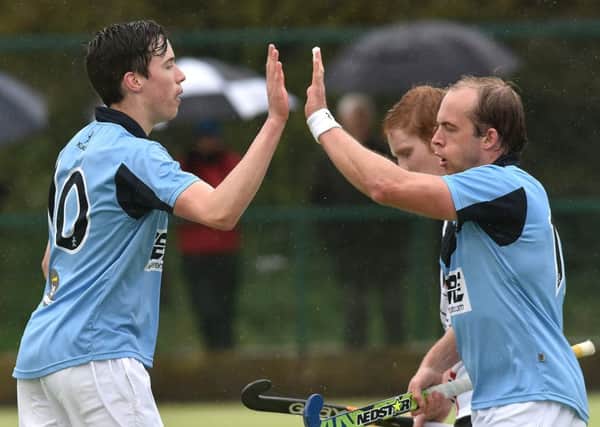 Garvey's Sean Murray, left, celebrates after scoring during Saturday's match. Photo by Tony Hendron / Presseye