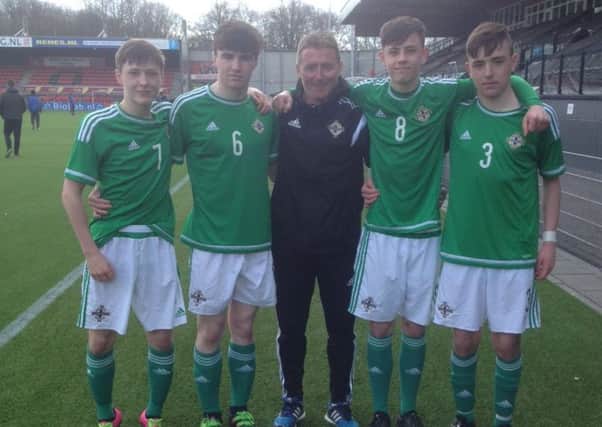 Darren Murphy (centre, IFA elite performance coach), a former Portadown player, with Northern Ireland youth internationals from the town club. From left, George Curran, Barney McKeown, Callum Ferris and Jack Conlon.