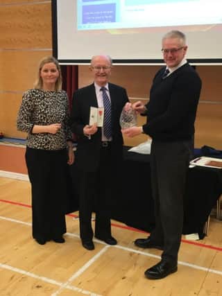 First photo includes Mrs Ros Corbett Vice Principal and Mr Alastair Mackay Principal presenting Trevor with a commemorative rose bowl from the staff and pupils to mark his achievement.