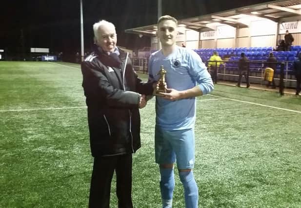 Aidan Murphy, presents Institute captain Stephen O'Donnell with his man of the match award after last night's Intermediate Cup win over Ballyclare Comrades.