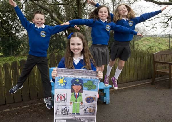 Meabh with her primary five class who will join her on a trip to London later this month courtesy of Aer Lingus after winning the airlines Art for Schools competition.