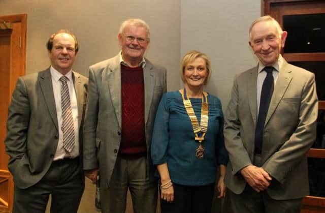 Brenda Houston, president of Carrickfergus Rotary Club, with (from left) associate Rotarian Ken Patterson, guest Malcolm Ashworth and author Rev Derek Weir. INCT 15-705-CON