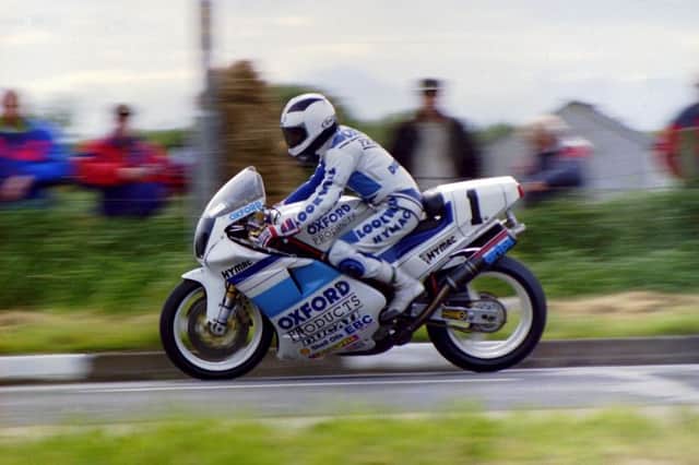 Robert Dunlop on the Oxford Products Hymac Ducati at the North West 200 in 1993.