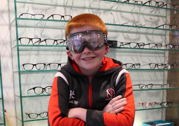 Ryan Totten (8) shows off his new eye wear sponsored by Richard Sweeney opticians in Belfast. INCR16