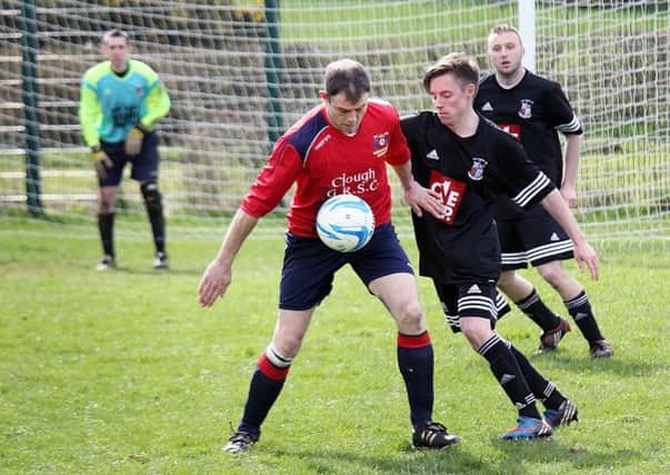 A Clough Rangers Athletic player shields the ball from his Ballynure Old Boys 'B' opponent during Saturday's match at Cloughwater Road. INBT 16-863H