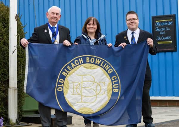 Pictured raising the club flag on the first day of the 2016 bowling season are Old Bleach Bowling Club president Fred Anderson, vice-president Ewart Evans and Karen Magrath who was representing her husband, 2015 President Bryan Magrath who sadly passed away recently. INBT 14-190CS