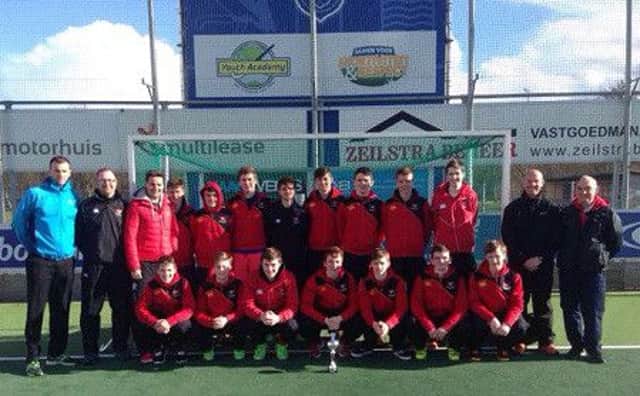 The Banbridge Academy squad show off their spoils after adding the JIPHT trophy to their All Ireland and Burney Cup successes.