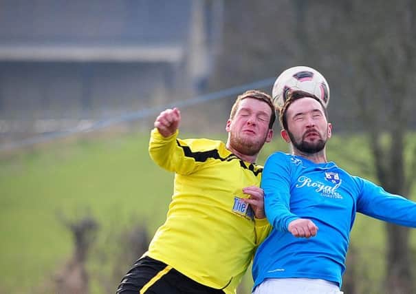 Desertmartin and Killymoon Rangers battle for the ball in the air during Saturday's local derby clash.INMM0916-337