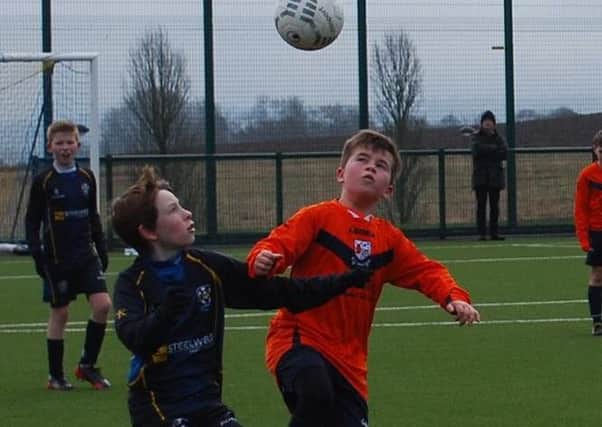 Only eyes for the ball in the CYFC 12s against Windmill Stars game last Saturday