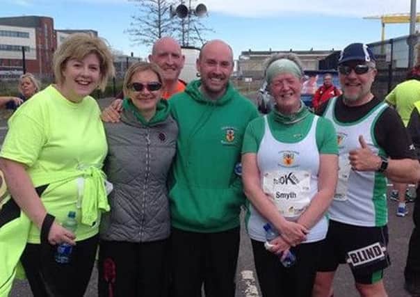 Thumbs up for County Antrim Harriers at the Titanic 10k. INLT 15-911-CON