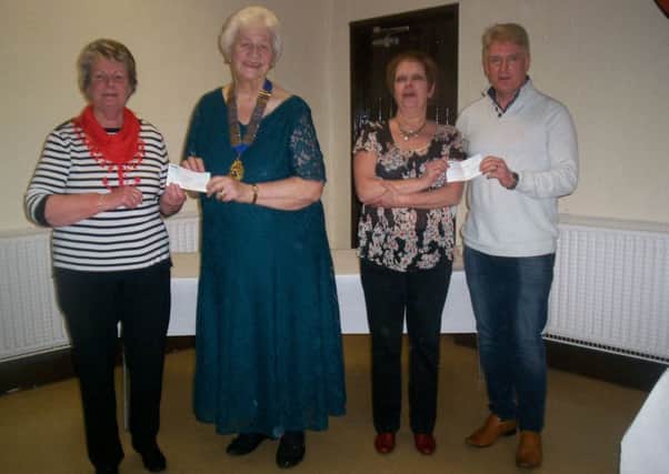 President Mrs. Eileen Mol presents cheque to Mrs. Betty Millar, Broughshane Improvement Committee. And treasurer, Mrs Ann McMaster, presents cheque to Sandy Wilson, Broughshane and District Community Association. Proceeds of Broughshane W.I. Table Quiz. Image submitted