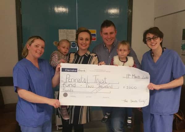 The Shiels Family pictured presenting acheque for Â£2,000 to some if the staff at The Royal Neonatal Unit. inbm16-16s