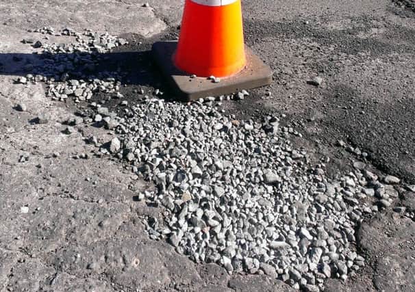 The road surface outside Larne MOT centre in its current state. INLT-16-701-con