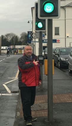 Lagan Valley UKIP candidate Brian Higginson at traffic lights near Lisburn Square.