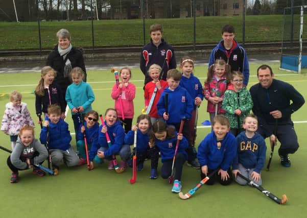 Antrim Hockey Club minis, pictured with co-ordinator Johnny McMeekin and assistants Adam Morrison and Jason Roe.