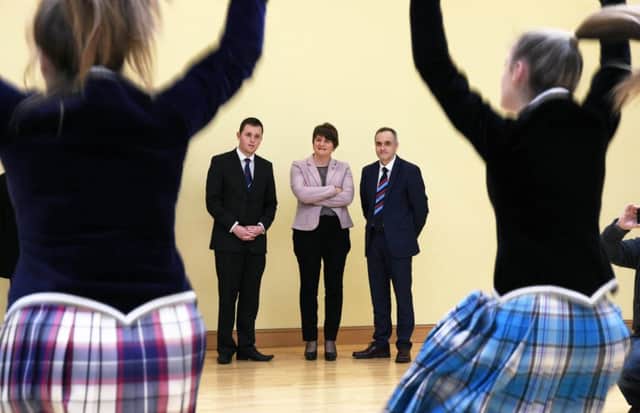 First Minister Arlene Foster MLA enjoys a display of Highland dancing during her visit to Lisneal College on Monday. Included are Gary Middleton MLA, and Michael Allen, Principal. INLS1616-139KM