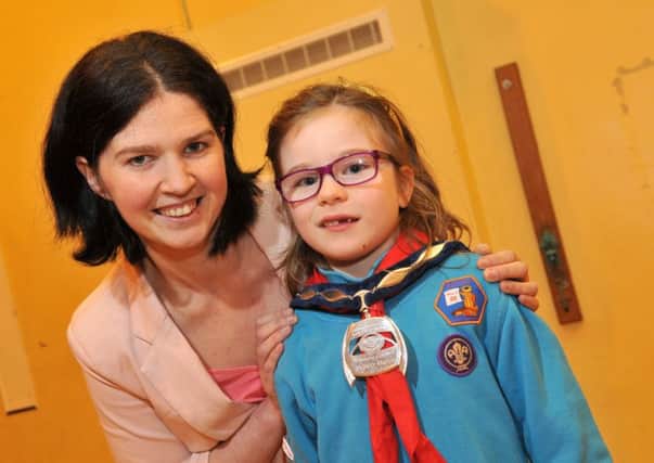 Three Spires Scouts member Iona who got to try on the Mid-Ulster District Council chain of office with the help of Vice-Chairperson Kim Ashton.INMM0916-359