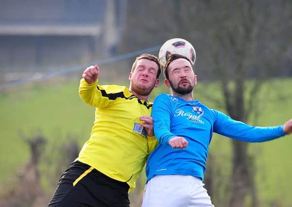 Desertmartin and Killymoon Rangers battle for the ball in the air during Saturday's local derby clash.INMM0916-337