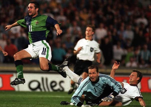 Michael Hughes scores for Northern Ireland against Germany in August 1997. Photo: Pacemaker