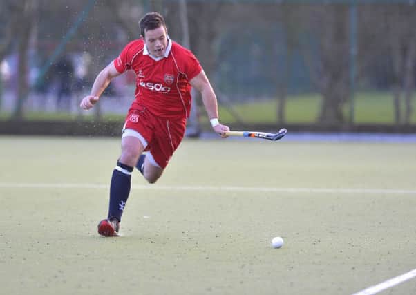 Mandatory Credit: Rowland White / PressEye
Men's Hockey: Premier
Teams: Annadale (white) v Cookstown (red)
Venue: Lough Moss
Date: 3rd January 2015
Caption: Simon Todd, Cookstown
