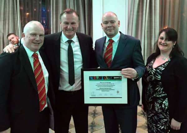 Carniny Amateur and Youth FC Officials Billy O'Flaherty (Secretary), Lee Barry (Chair) and Gail Kernohan (Club IFA Volunteer) officially receiving the Club Excellence Award on behalf of the club from N Ireland Manager, Michael O'Neill, CEO Patrick Nelson and President Jim Shaw at the IFA Club and Volunteer Awards