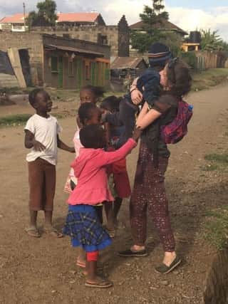 Sarah Rose Duff, a Year 13 pupil from Dromore High School with some of the children from Nakuru, Kenya that she met on a school mission trip
