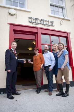 Mayor of Antrim and Newtownabbey, Councillor Thomas Hogg, officially opens Lizie Nellie with proprietor Liz Corrigan, her husband Paschal and sisters Patricia Crawford and Roisin Chesney.