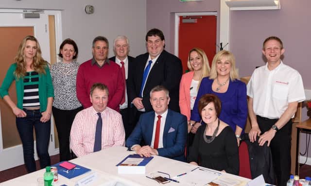 Danny Kinahan MP (seated left) with local political and business representatives at Mallusk Enterprise Park. INNT 16-532CON