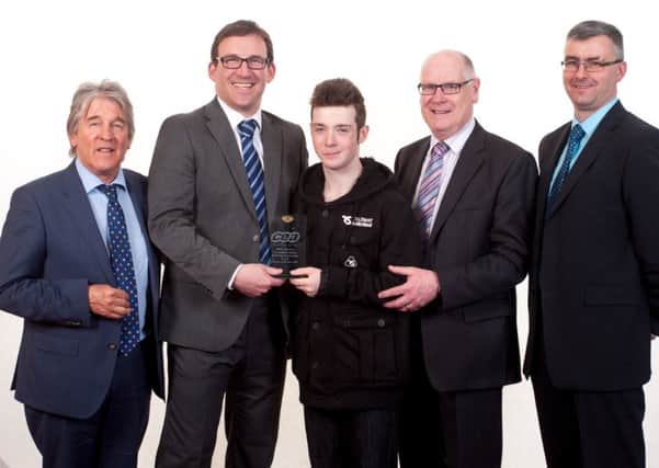 Bailey McCrea from Northern Regional College Ballymena  with NRC Ballymena Staff and CCEA Chief Executive Justin Edwards at the CCEA awards where he received his award for Occupational Studies, Technology and Innovation> (Submitted Picture).