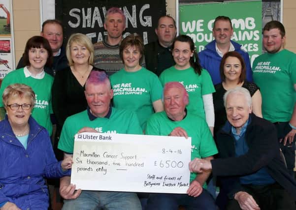 Jim Beggs (front row, second from left) with colleagues at Ballymena Livestock Market following the sponsored shave, which has since raised over Â£8500.  INCT 17-720-CON