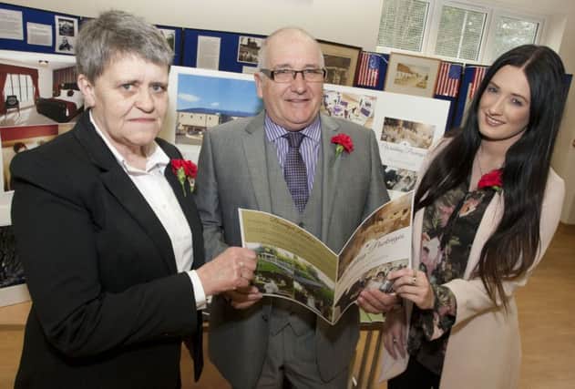 LOOKING. Organiser of the 'Showcasing Dervock' event on Saturday, Peter Thompson, pictured along with Linda Henry and Cheryl McCook from the Hedges Hotel.INBM12-16 045SC.