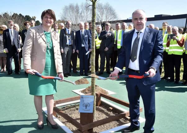 First Minister, Arlene Foster and Hyster Yale Craigavon plant manager, Jim Downey plant a tree to mark the 35th anniversary of the opening of the factory in 1981. INPT16-214.