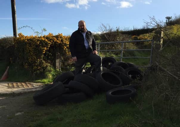 Councillor Mark Baxter at Pat's Turn, Donaghcloney, where some of the illegal dumping has taken place.