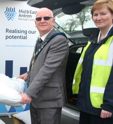 Mayor Cllr Billy Ashe is pictured collecting compost with Elaine Smith, Environmental Services Manager Mid and East Antrim Borough Council. (Submitted Picture).