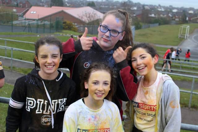 Year 9 students having fun at the colour run, Amy (on the left), Patrycja(middle, back), Ashleigh (middle, front) and Rebecca (on the right). INCT 17-704-CON