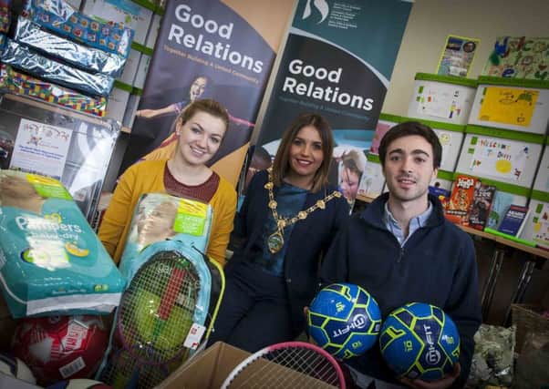 REFUGEE APPEAL. . . . .The Mayor of Derry City and Strabane District Council, Elisha McCallion pictured with Niamh Scullion, Community Relations Student Placement and Ezra Coopersmith, Community Relations Intern, during this week's 'Mayor's Refugee Appeal' final check of donations at the Shared Future Centre, Irish Street.