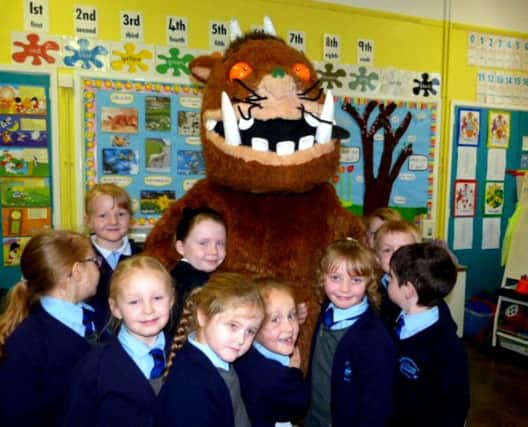 The Gruffalo greets children at Carrickfergus Central Primary School. INCT 17-705-CON