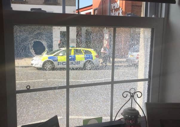 Damage caused to a window at Brown's Coffee Shop in Ballyclare. Pic courtesy of Love Ballyclare. INNT 17-805CON
