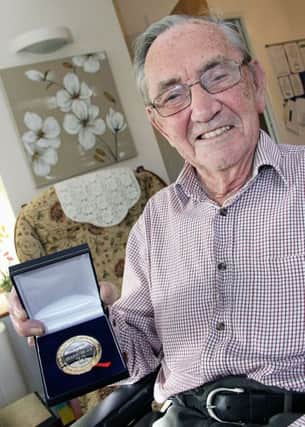 Wallace Allen, a resident in Abbeyfield and Wesley,  proudly holds his MacLeod medal for 70 years living with diabetes. INBT 18-801H