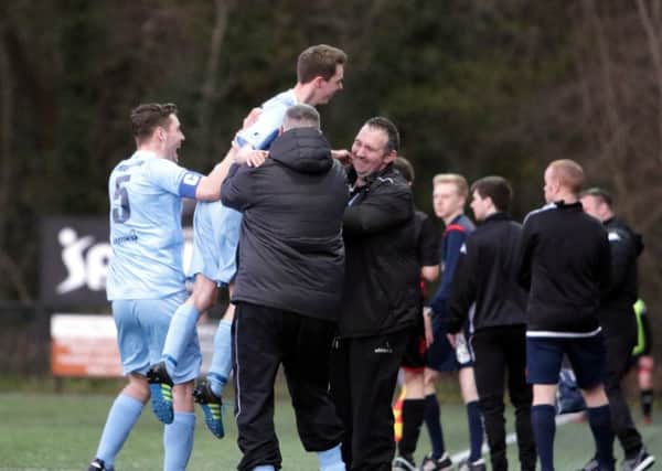 Josh McCready celebrates with manager Clifford Adams and team-mates after scoring for Ballymena United Thirds in their Harry Cavan Youth Cup final defeat by Crusaders. Picture: Damian McKee/Picture Magic Studios.